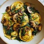 Deliciously Creamy Mushroom Ravioli with Fresh Spinach Delight - Featured Image