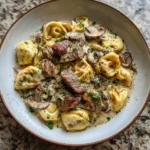 Cracked Garlic Steak Tortellini in Creamhouse Sauce Recipe You Need to Try - Featured Image